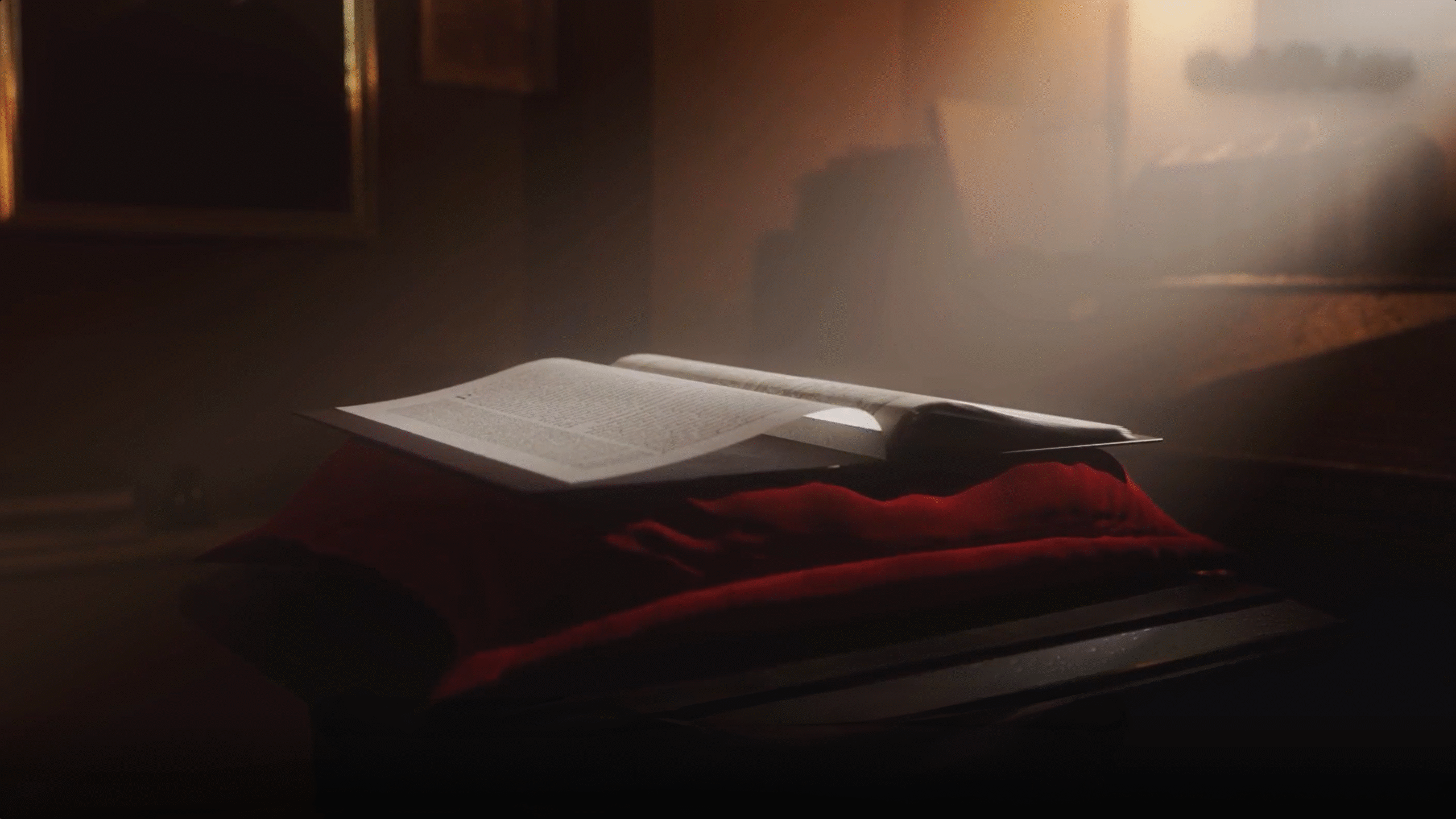 Modélisation d'un livre ouvert posé sur un tissu sombre, éclairé par une lumière chaude