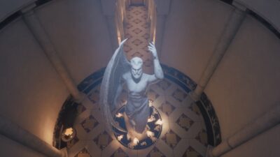 Personnage assis dans une salle circulaire