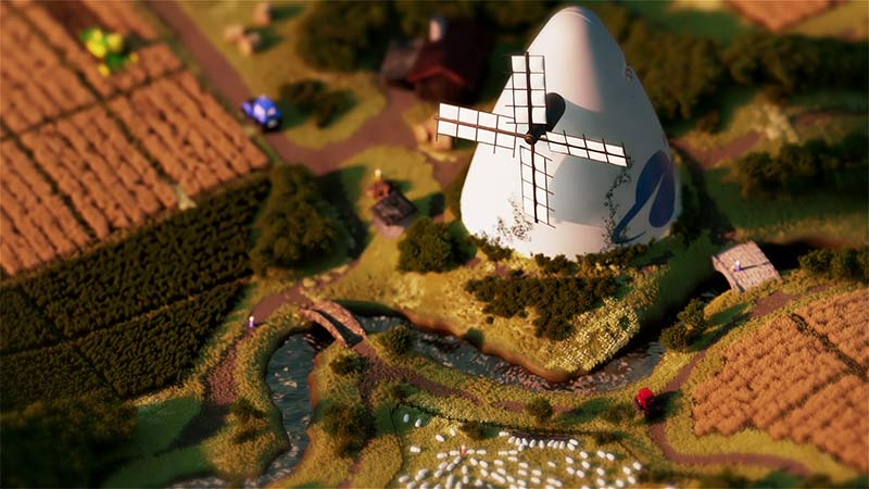 Maquette 3D d’un moulin blanc au milieu de champs et d’un paysage miniature
