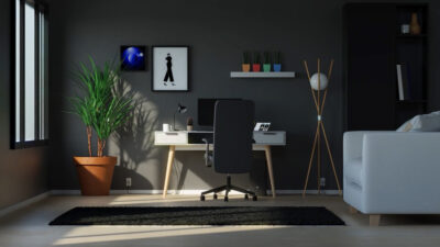 Bureau moderne minimaliste dans une pièce sombre, avec plantes vertes, mobilier noir et blanc et lumière naturelle venant de la fenêtre.