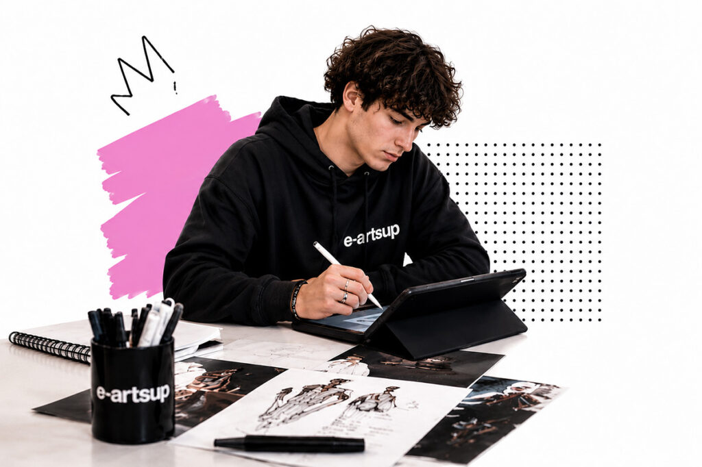 Étudiant e-artsup travaillant sur une tablette graphique dans un espace de création, avec dessins et outils de conception.