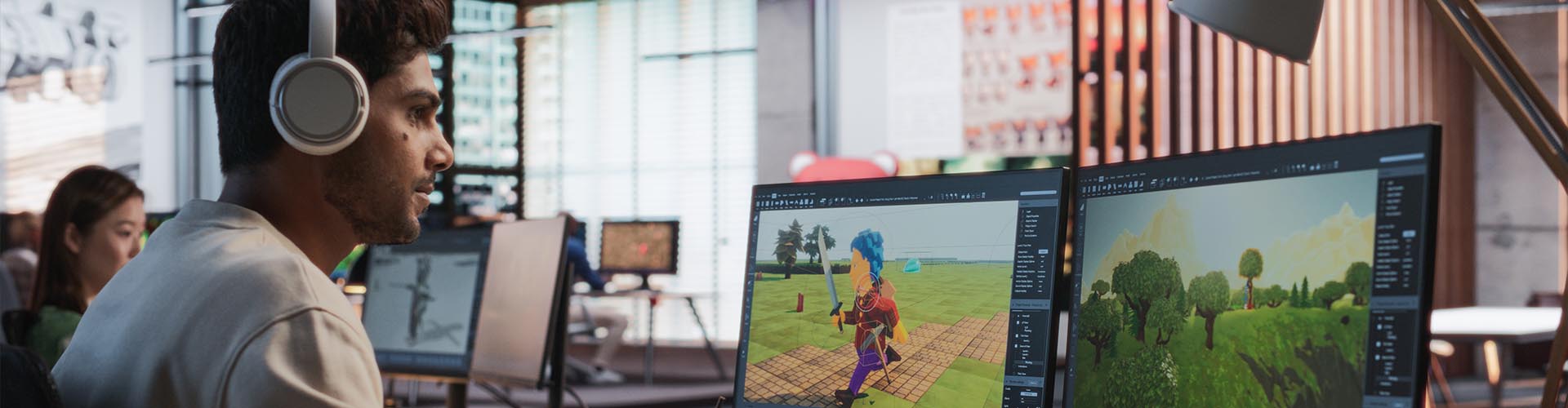 Modeleur et concepteur 3D avec un casque audio travaillant sur la création d'un jeu vidéo de style low poly face à deux écrans.